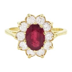 14ct gold oval cut ruby and round brilliant cut diamond cluster ring, stamped, ruby approx 0.90 carat, total diamond weight approx 0.50 carat