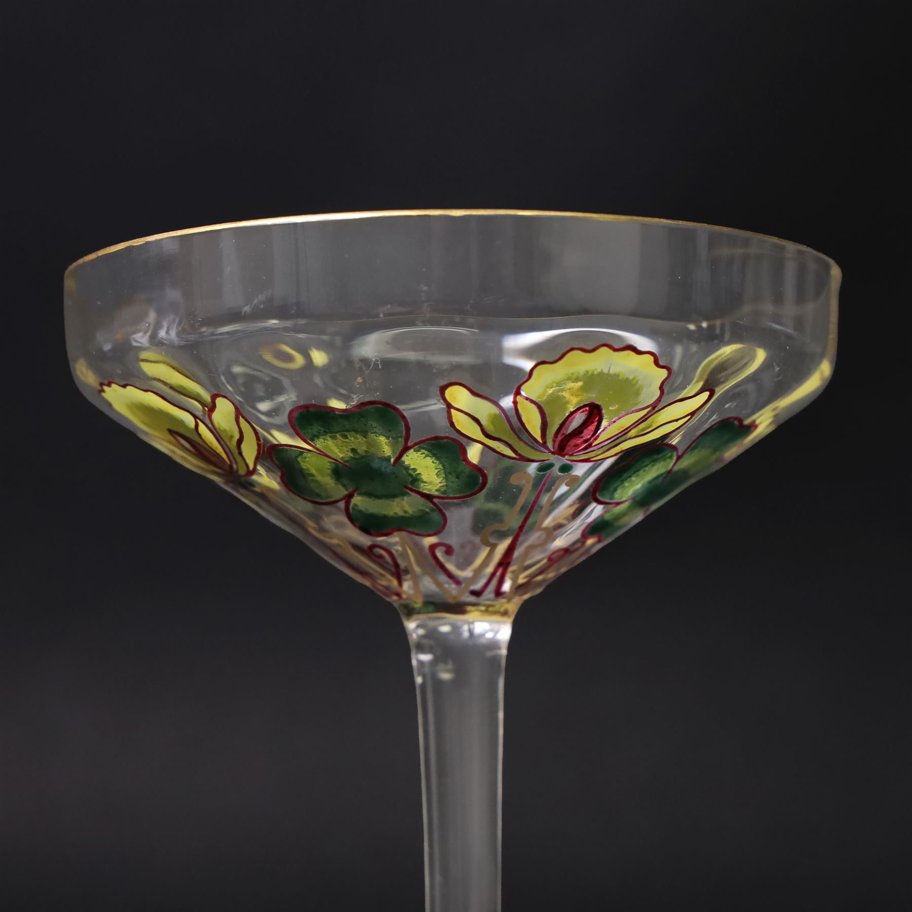 Pair of early 20th century Theresienthal Art Nouveau hand painted glass champagne coupes, the bowls hand painted with flowers, the bowl and foot rims lined in gilt, H13.5cm