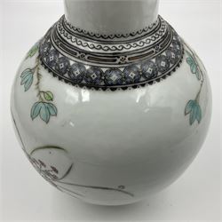 Pair of Chinese Republic porcelain vases, each painted in Famille Rose enamels with pairs of pigeons amidst peony, rock, flowering plants and leafy branches, possibly Qianlong seal beneath, H22cm 