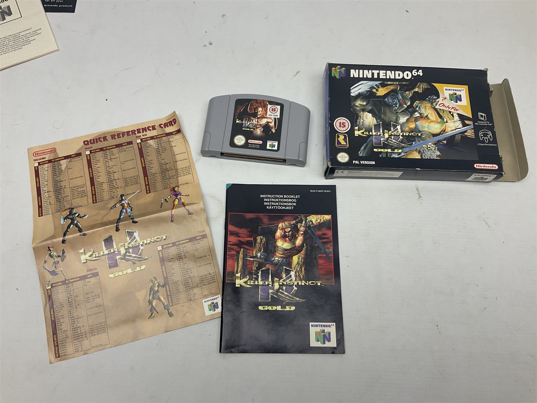 Nintendo 64 console, two controllers, games and accessories. Accessories to include the ‘Tremorpak’ and ‘Spook’ 2 Phono plugs and a S-VHS plug with adapter, both in original boxes. Games to include ‘Golden Eye 007’, ‘Doom 64’, ‘Killer Instinct Gold’, ‘Tetrisphere’, ‘F-1 World Grand Prix’, ‘Pilotwings 64’ and ‘Lylatwars’ with ‘Rumble Pak’, all with original boxes and instruction manuals. ‘Star Wars Episode I Racer’ game cartridge in Shadows of the Empire box. 