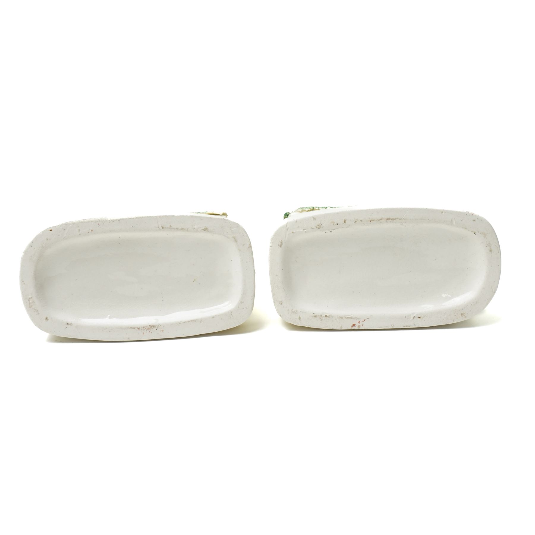 Pair of late 19th century Staffordshire pen holders, modelled as dogs in kennels, W9.5cm