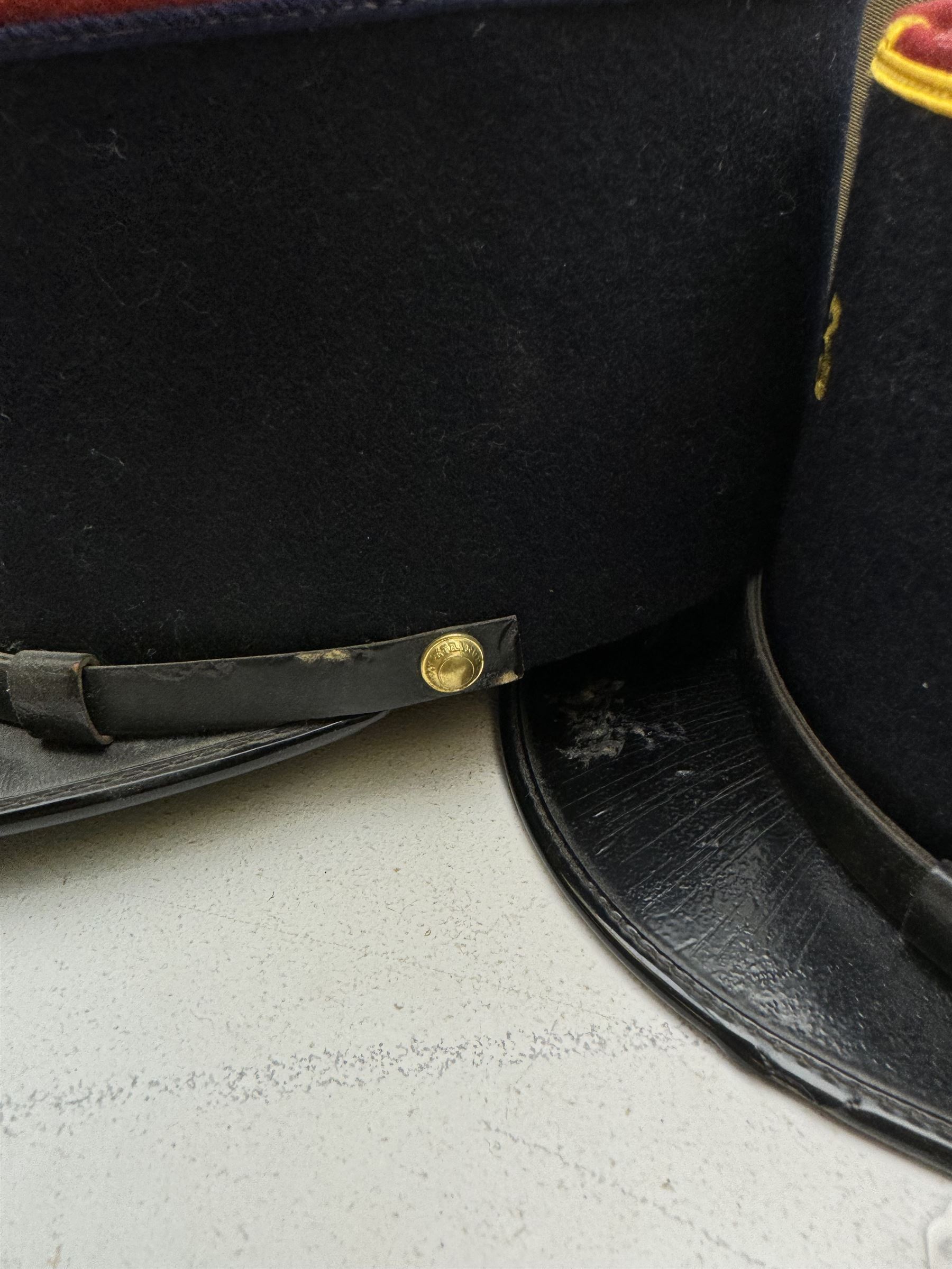 Three French Foreign Legion Kepis; two infantry examples and the third Calvary, each with black peak, original leather sweatband and markers mark stamped inside 