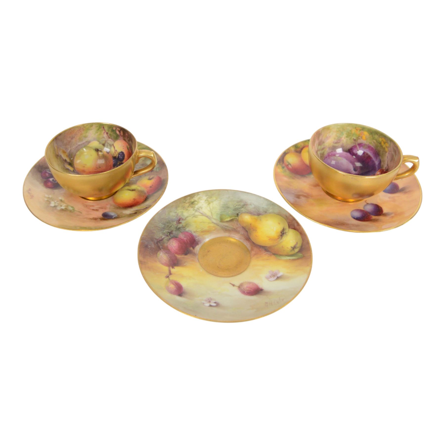 Two small 20th century Royal Worcester cabinet cups and saucers, together with another saucer, each painted with a still life of fruit upon a mossy ground, bearing various signatures: E Townsend, Ricketts, G H Cole, and H Ayrton, each with puce printed mark beneath, teacups approximately H3cm D5.5cm, coffee cup H4.5cm, saucers 9.5.cm