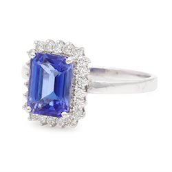 18ct white gold tanzanite and diamond cluster ring, single octagonal cut tanzanite of approx 0.80, surrounded by twenty-two round brilliant cut diamonds, stamped, total diamond weight approx 0.25 carat