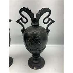 Pair of late 19th century continental black glazed urn shaped two-handled vases with classical style decoration H39cm