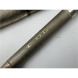 Three parker fountain pens, one example with 14ct gold plated cap and personal engraving, in Parker 51 box, together with a silver Sampson Mordan Everpoint propelling pencil with personal engraving and a silver cased fountain pen with 14ct gold nib and a souvenir bronze Dollfus-Mieg medallion, awarded to John G Sedorski, in fitted case 