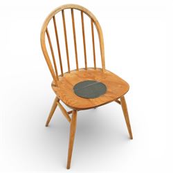 Ercol - elm dining chairs, a set of five comprising four side chairs and one '370' armchair, all with hoop backs formed with slender spindle splats, shaped solid elm seats, the armchair with curved out-swept arms, raised on splayed turned supports united by stretchers