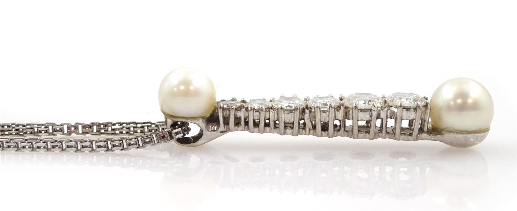 18ct white gold pearl and diamond pendant necklace, six graduating round brilliant cut diamonds set between two white cultured pearls, the largest two diamonds approx 0.55 carat each, total diamond weight approx 1.90 carat