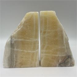 Pair of honey onyx bookends of rectangular form with polished to three sides with a raw outer edge, H18cm 