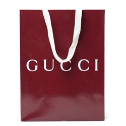 Gucci GG Marmont black matelassé leather top handle bag, made in Italy, with chevron quilted leather and heart motif to the reverse, antique gold-tone Double G front hardware, leather top handle and detachable chain shoulder strap with leather shoulder guard, front flap closure, suede-effect interior with zip pocket and leather logo tab stamped Gucci made in Italy, together with original Gucci dust bag and carrier, W27cm D11cm H20cm