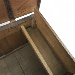 18th century oak five panel chest, with planked top with chamfered edges, hinged top enclosing two candle boxes, five fielded panels flanked by foliate carvings, raised on stile supports