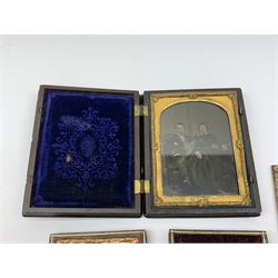 A Victorian ambrotype photograph in gilt surround and Vulcanite type Union case, decorated in low relief to front and verso with a female figure upon horseback, H12.5cm, together with a leather case daguerreotype, and a further loose example. (3).  