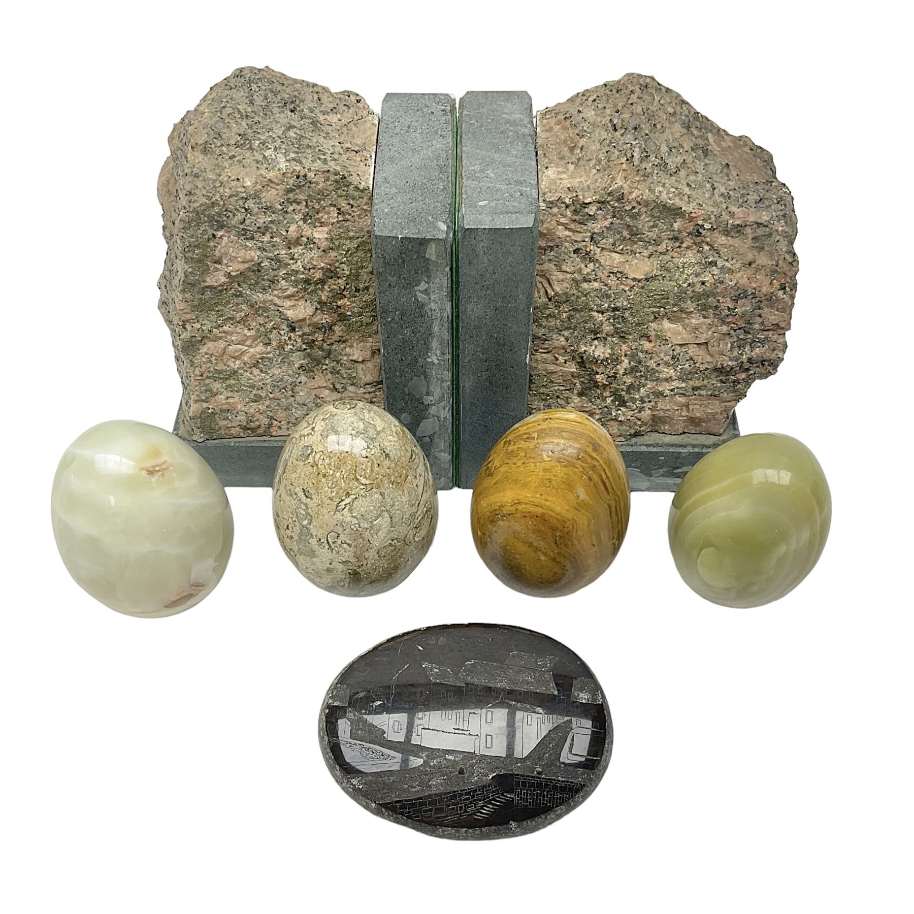 Fossilised coral egg, together with three onyx eggs, mineral bookends and a carved stone