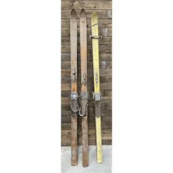Two pairs of vintage skis, L207cm and 197cm