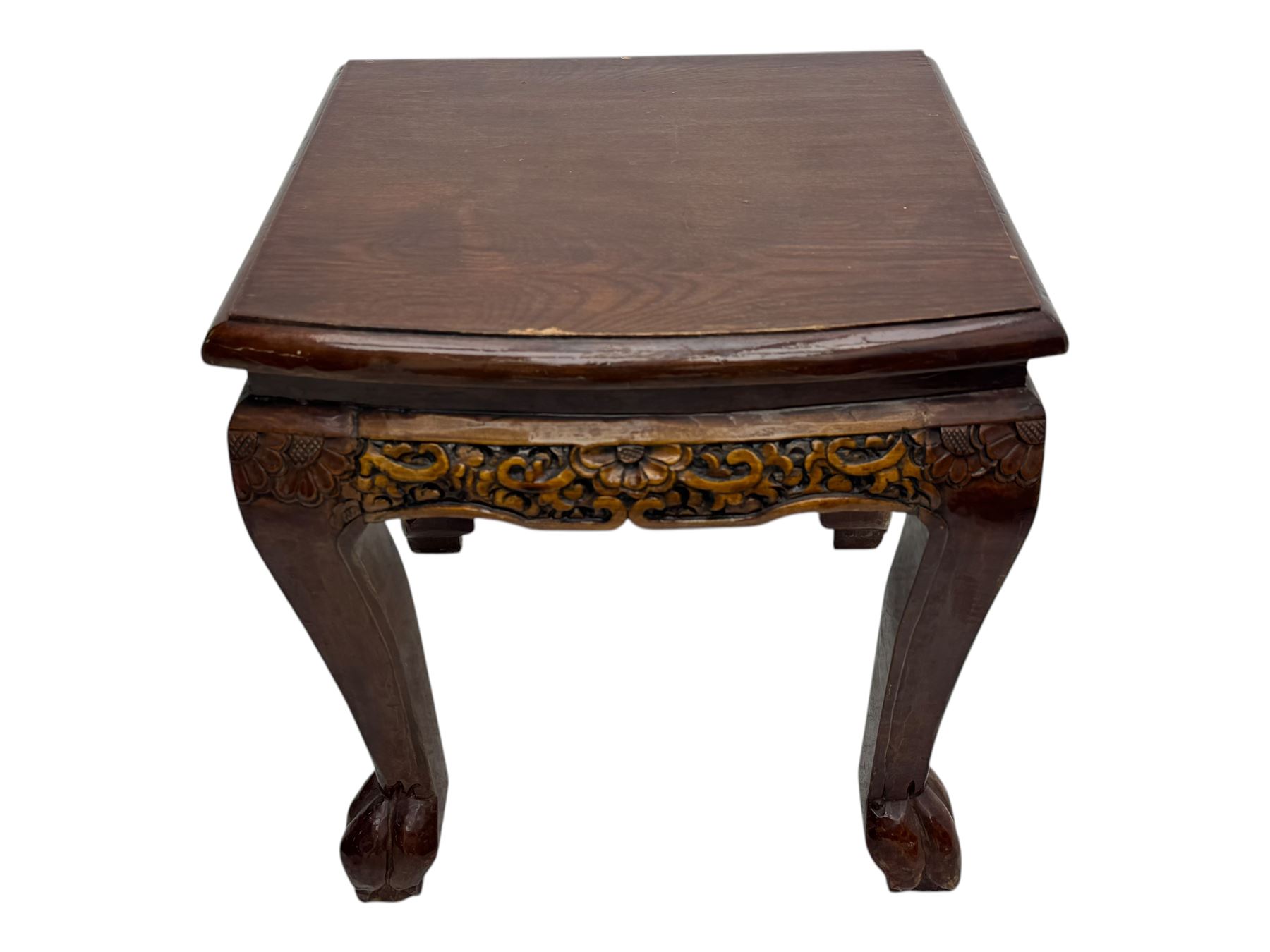 Early 20th century Chinese hardwood nesting coffee table, oval top carved with figures and traditional pagoda scenes with carved frieze, complete with six inset stools or side tables, raised on tapering supports with paw feet
