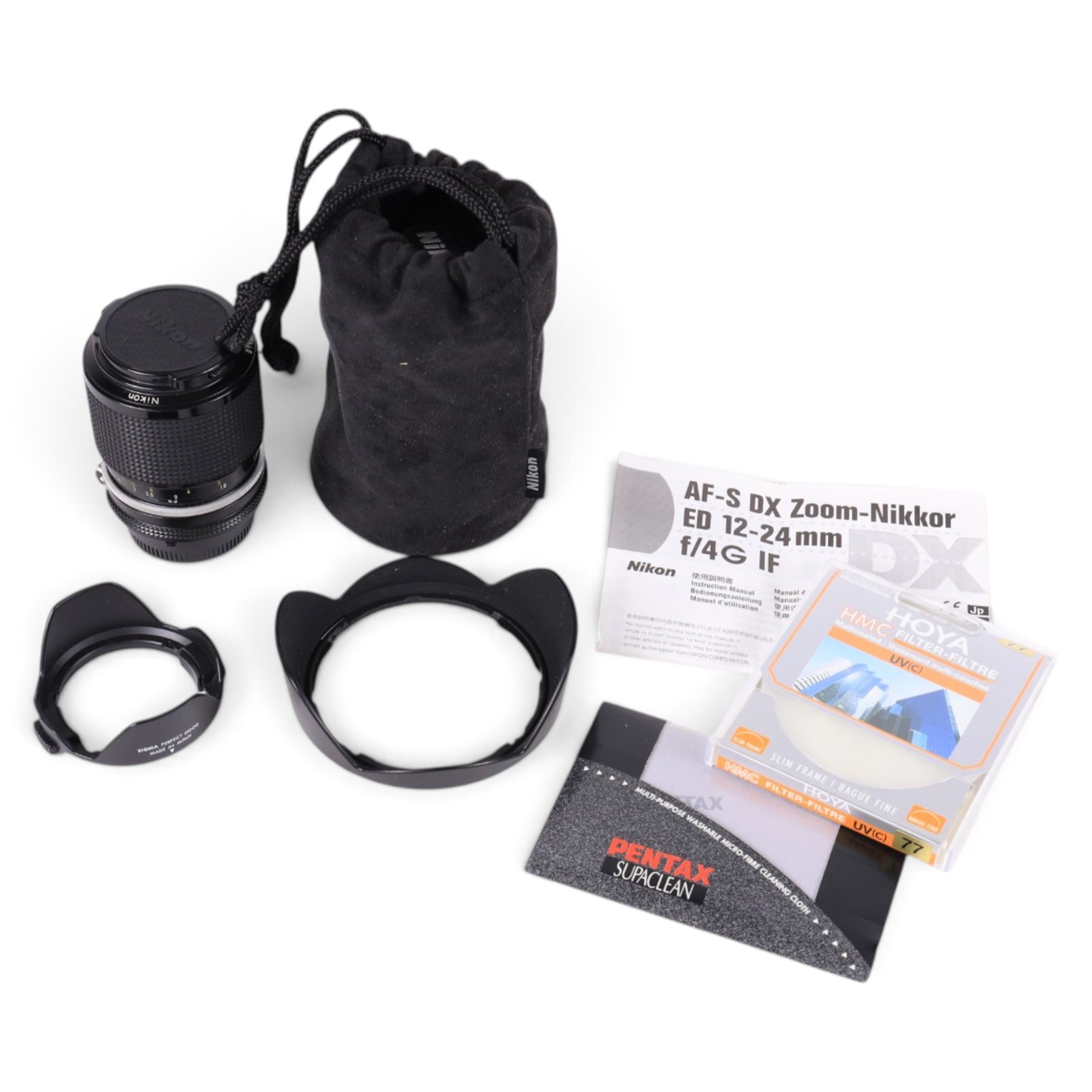 Two Nikkor lenses, comprising AF-S DX 12-24mm 1:4G ED serial no. 259461 and Zoom-Nikkor 43-86mm 1:35 zoom serial no. 1047648