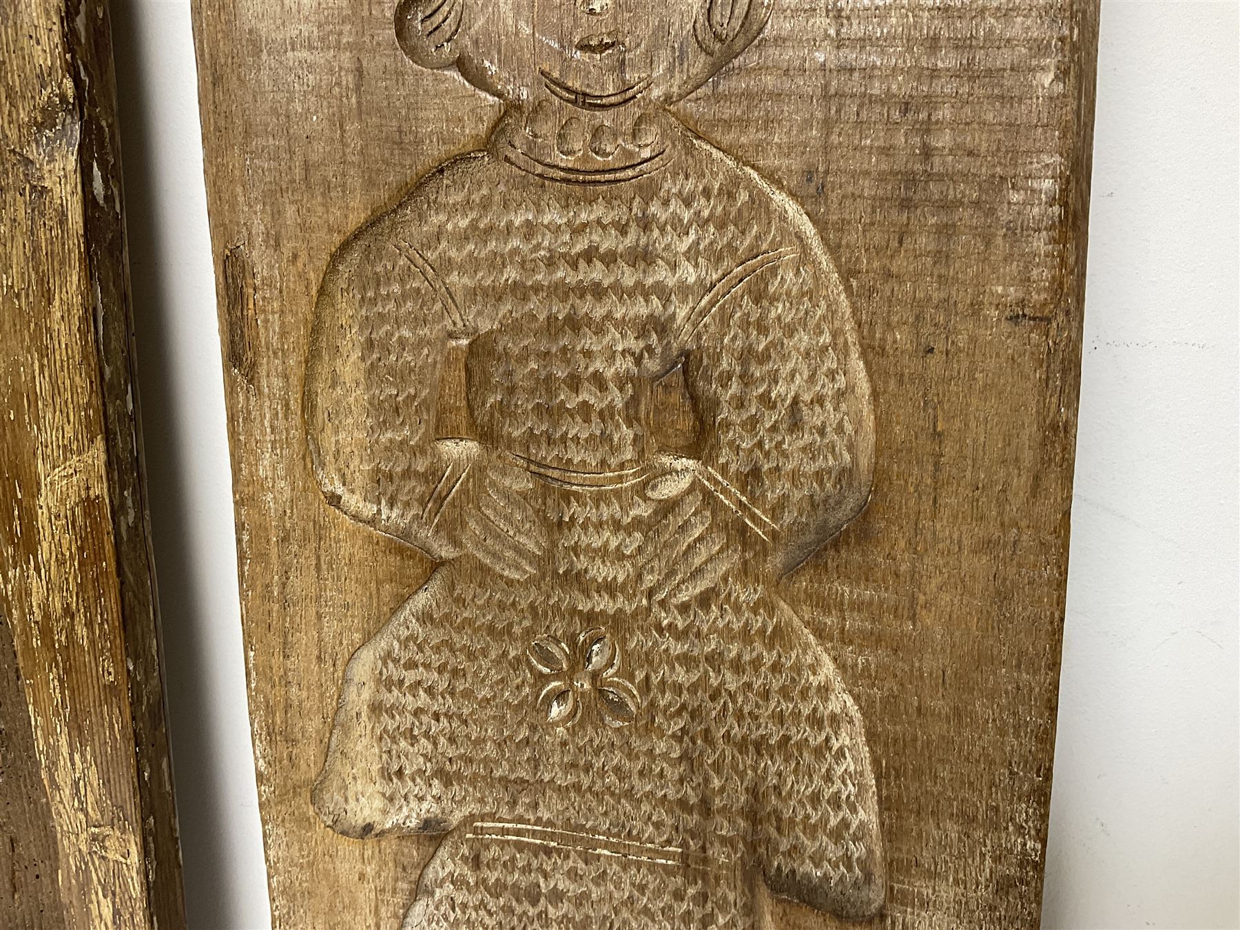 Two 20th century hardwood Dutch folk art Speculaasplank or biscuit moulds, typically carved with figures in traditional dress, largest H101cm
