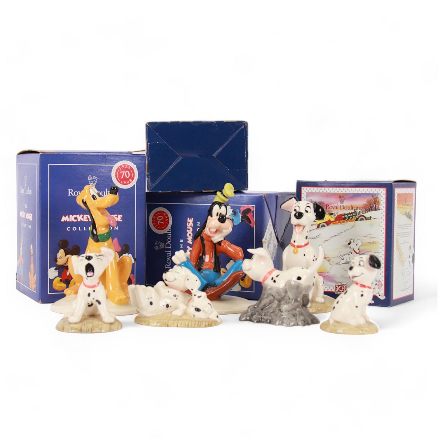 Seven Royal Doulton Disney figures, comprising Goofy, Pluto and five 101 Dalmatians figures Pongo, Penny and Freckles, Rolly, Penny and Lucky, all boxed 