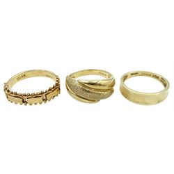 9ct gold textured crossover ring, 14ct gold articulated link ring and another 9ct gold ring, all stamped or hallmarked 