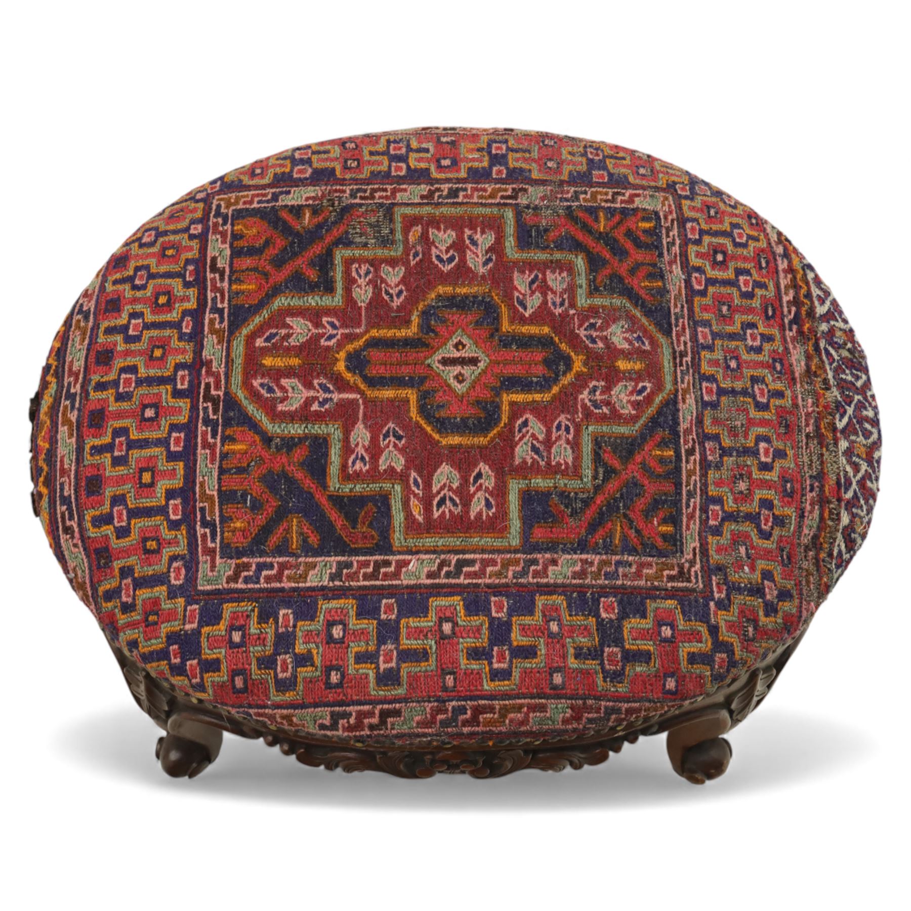 Two upholstered and caned footstools, a late Victorian carved mahogany footstool, oval form upholstered in geometric kilim-style fabric, on cabriole supports (H 27cm, W 56cm, D 47cm), together with a 20th century beech stool, square caned seat on turned supports united by stretchers (H 43cm, W 44cm, D 37cm)