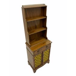 Regency style mahogany side cabinet, three open shelves above single drawer and two grill cupboards