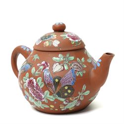 Pair of 18th century Chinese famille rose plates, painted profusely with flowers, D23cm; together with a Yixing teapot, painted with butterflies, H12cm (3)