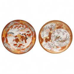 Japanese Meiji Kutani shallow bowl decorated with birds with fan shape and circular panels in orange and gilt, character mark to base D30cm and another Japanese bowl decorated with a centre panel of figures in orange, gilt etc D30cm (2)