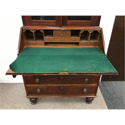  19th century mahogany bureau with bookcase top, two doors, fours shelves above fall front with fitted interior, four graduation drawers, turned supports, W104cm, H233cm, D51cm  