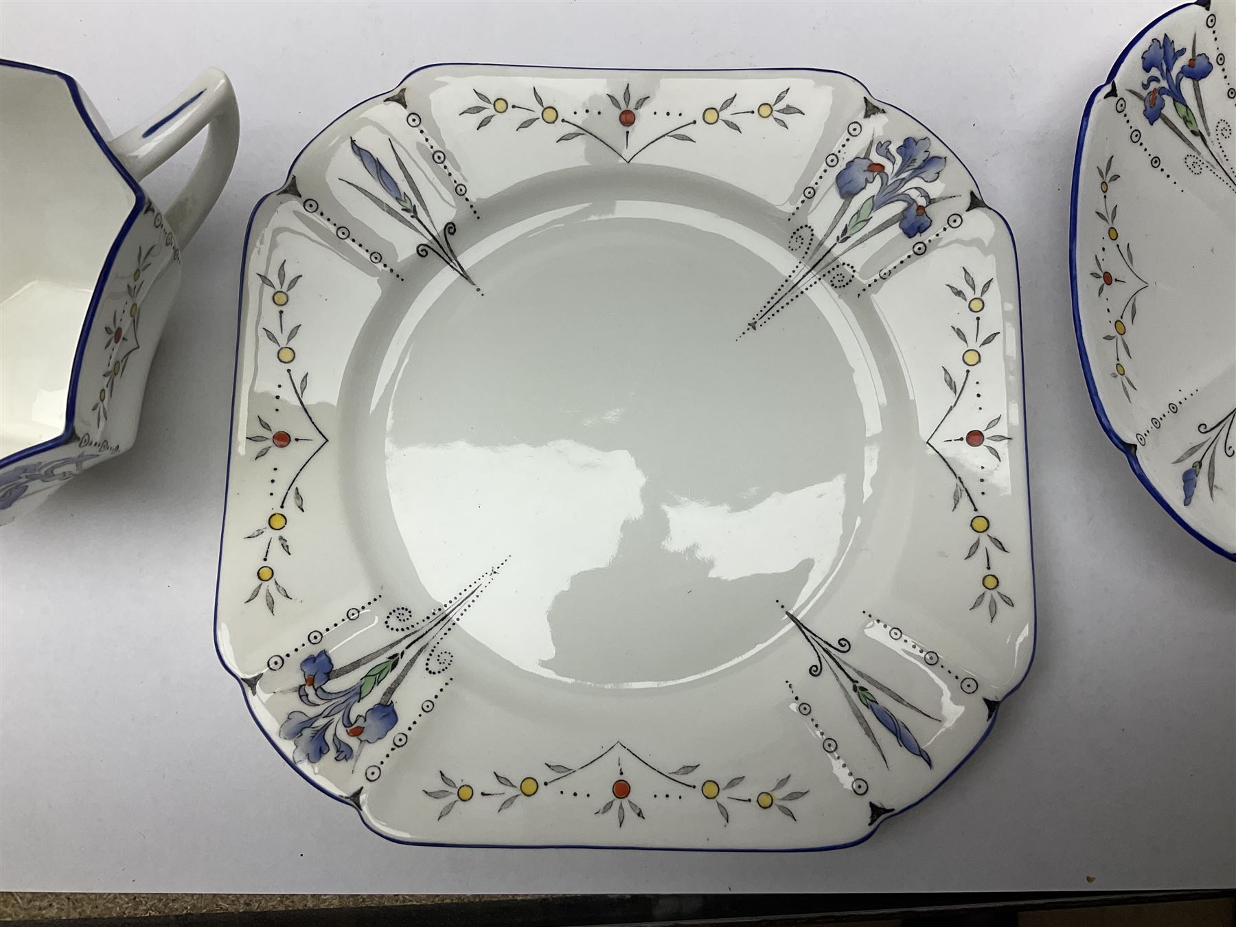 1920s Shelley Queen Anne shaped trio, decorated in the Blue Iris pattern no. 11561, ith printed mark beneath 