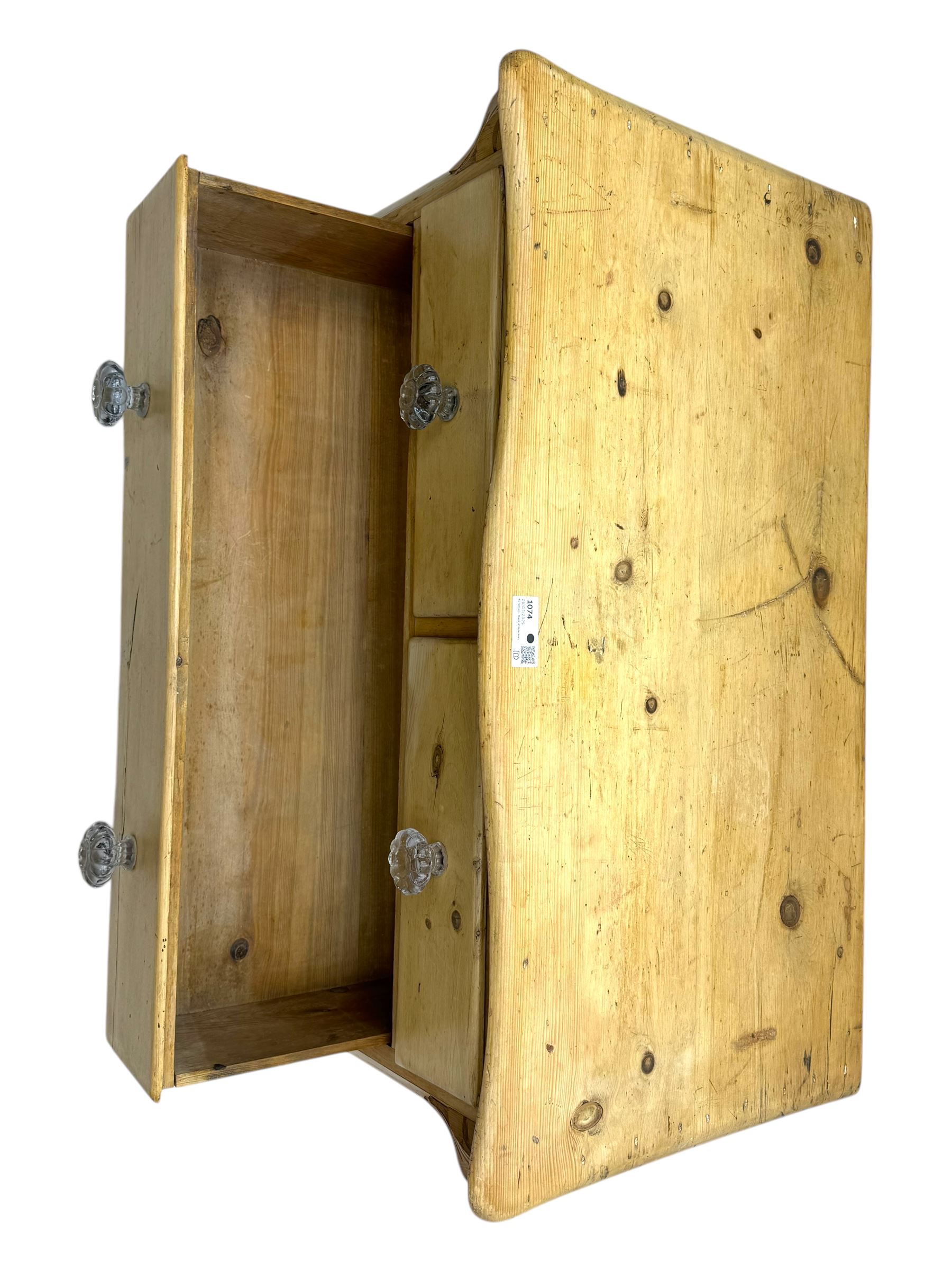 19th century continental pine chest, shaped serpentine top over two short and two long graduated drawers, on turned bun supports