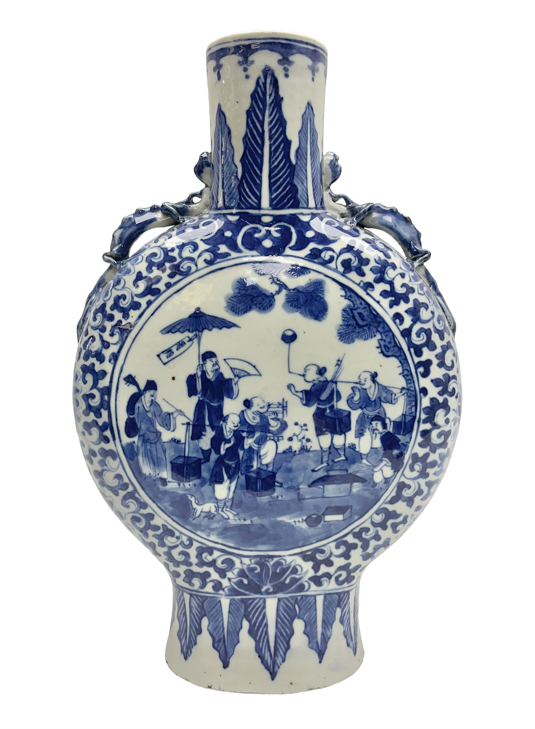 19th century Chinese blue and white moon flask vase, the central panel depicting musicians, bordered by floral, foliate and scroll decoration, with lizard handles to each shoulder, upon an oval foot, H31cm 