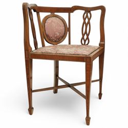 Edwardian inlaid mahogany corner chair, shaped cresting with satinwood band over interlaced splats, upholstered in floral pattern fabric, on square tapering supports with spade feet united by X-stretcher 