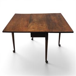 18th century solid walnut drop leaf table, with gate legs terminating in pad feet