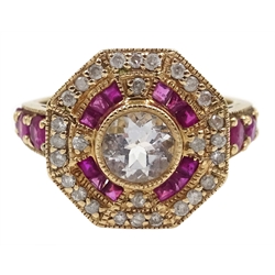  Gold ruby and diamond surround octagon dress ring, set with a central pale blue stone, stamped 10K  