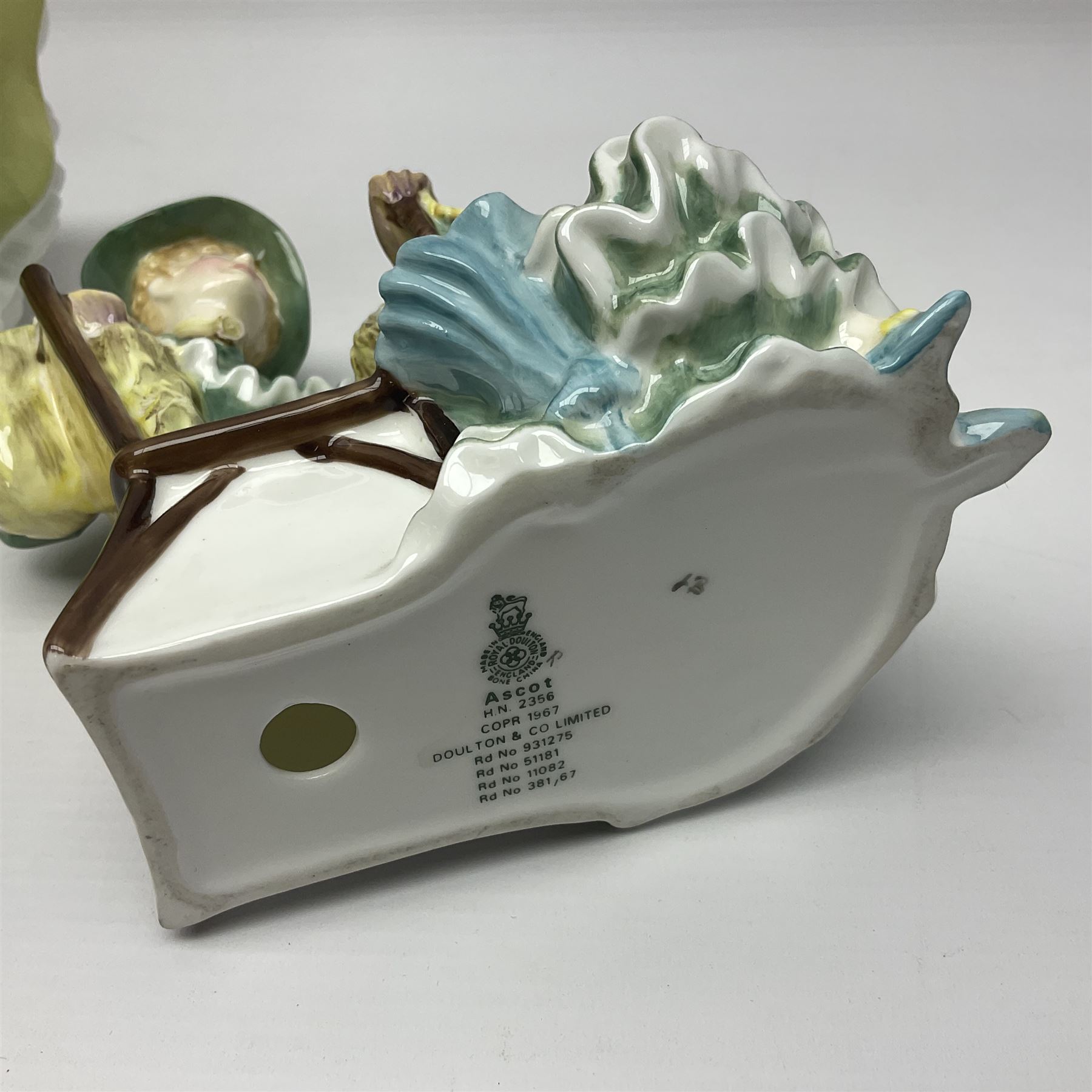 Two Royal Doulton figures, Buttercup HN2309 and Ascot HN2356, together with Capodimonte figure Hussar and His Lady 