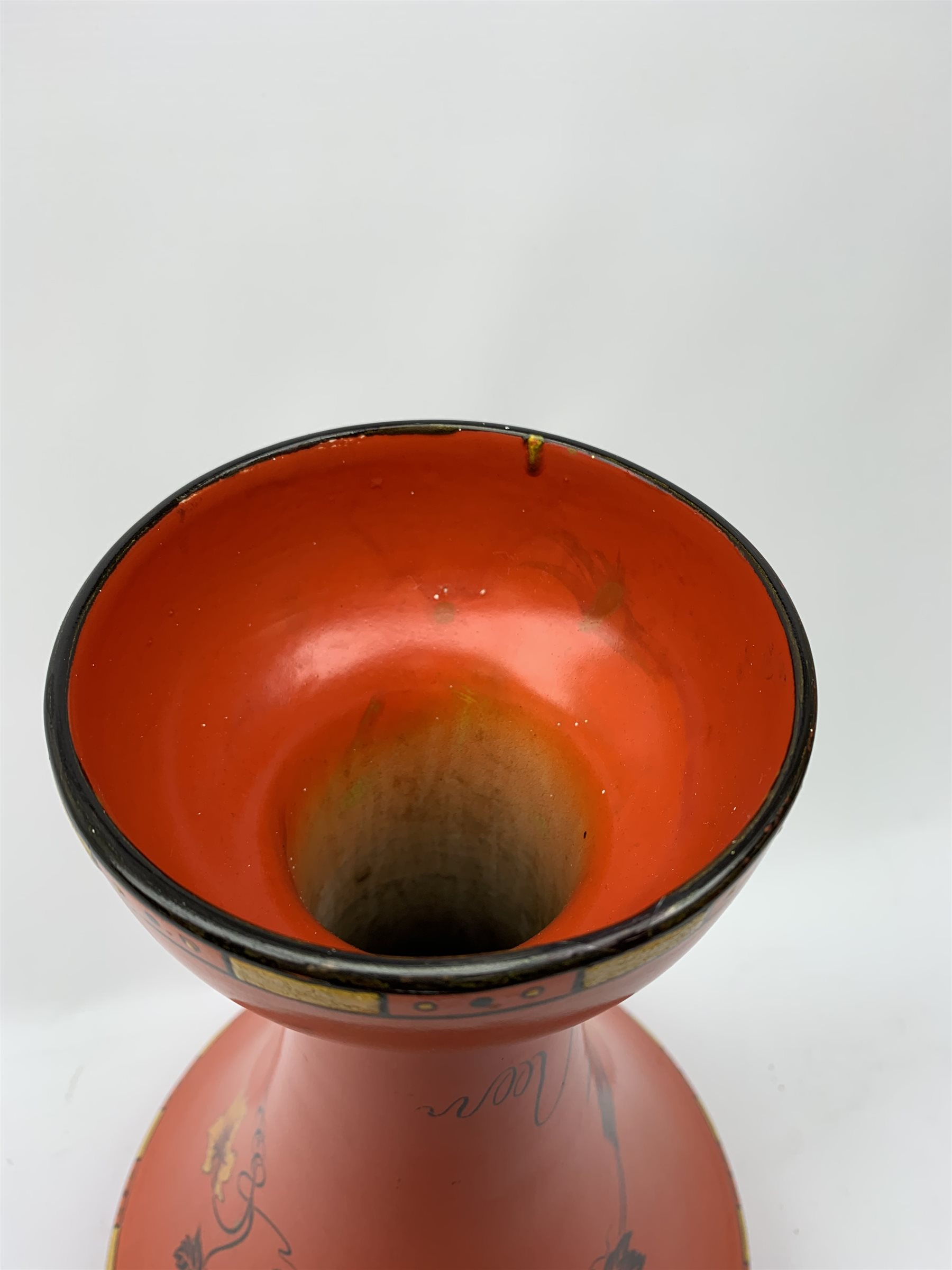 A large Shelley vase, of bulbous form with waisted neck and flared rim, the red ground decorated with the Vine and Grape pattern, with printed mark beneath and painted pattern no 8632, H41cm. 