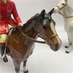 Beswick hunting group, comprising huntswoman on dappled grey horse no 1730, huntsman on bay horse no 1501, two fox figures no 1440 and 1748, and four fox hounds, all with printed marks beneath (8)