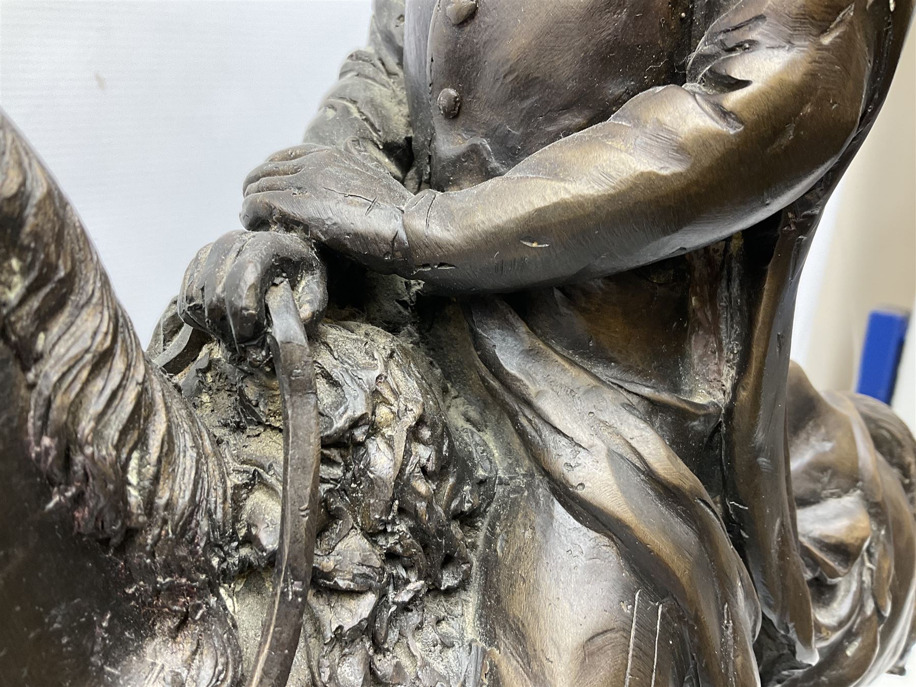 Large and impressive bronze figure of Wellington seated on a horse, on a sarcophogus shaped stepped base impressed 'Meunier Paris', the canted corners inset with battle trophies H68cm L50cm D22cm