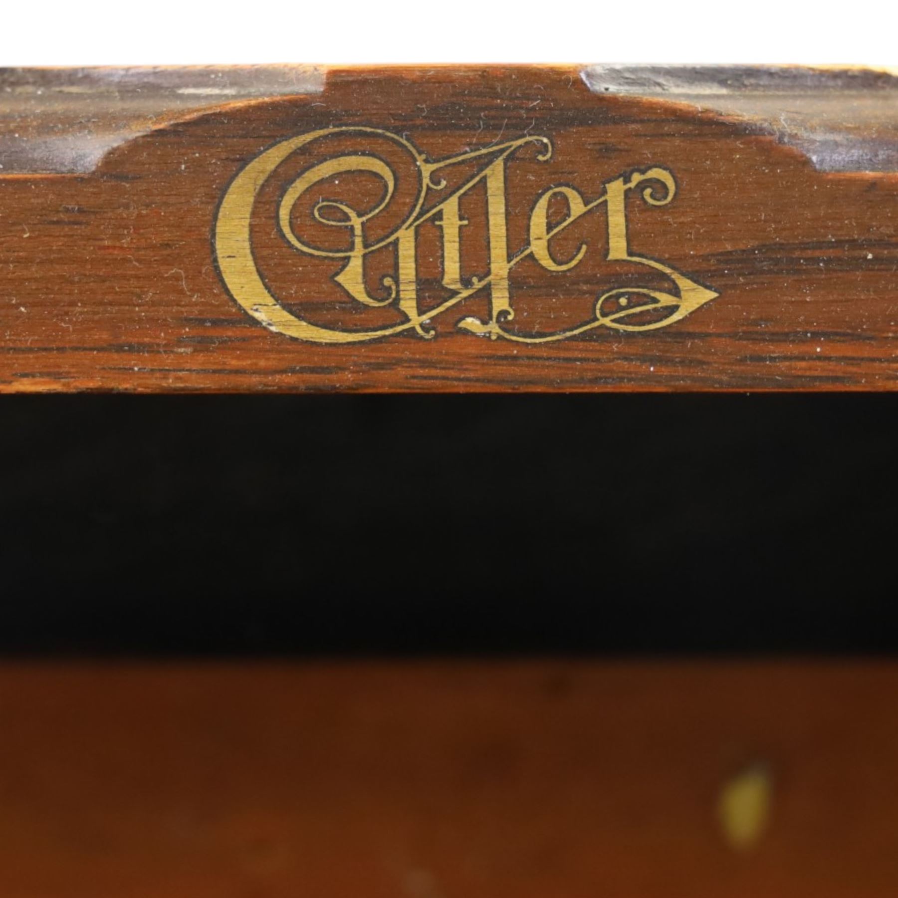 Cutler - Late Victorian oak pedestal tambour desk, the tambour shutter enclosing fitted interior, pull-out writing surface over central kneehole flanked by two pedestals each fitted with four drawers with moulded fronts, pull-out slides above, panelled sides, on moulded plinth base