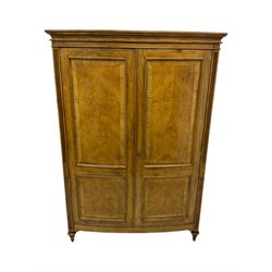 Frank Hudson - mid-20th century Mindi ash and burr walnut double wardrobe, moulded rectangular cornice over two panelled doors with chevron pattern veneers, raised on turned supports