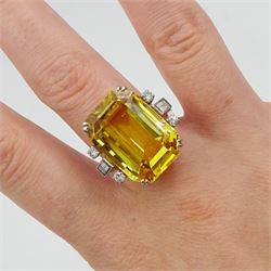 Palladium natural yellow sapphire ring, set with three baguette and round cut diamonds either side, sapphire approx 28.00 carat, with The Gem & Pearl Laboratory report stating no evidence of heat treatment, origin opinion Sri Lanka, colour transparent yellow