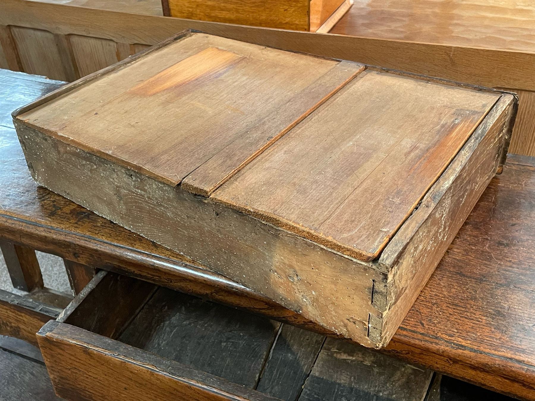 18th century oak dresser base, moulded rectangular top over two drawers and shaped apron, moulded drawer fronts fitted with shaped brass handle plates and swan neck handles, on chamfered square supports united by pot board base 