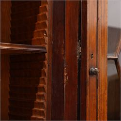 Large Georgian mahogany library bookcase, projecting moulded cornice with row of globular mounts, adjustable shelving enclosed by six astragal glazed doors, fitted with two slides and six panelled cupboard doors, two banks of five drawers, on moulded plinth base; together with two pairs of associated astragal glazed doors in mahogany, from the same property (W55.5cm x H168cm & W48cm x 168cm)
