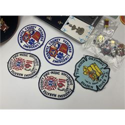 Quantity of pin badges and sew on patches to include Robertson’s Golly, featuring pre-WW2 examples, The Magic Roundabout, Hard Rock Cafe etc 