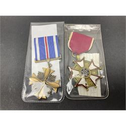 Nine American medals comprising Legion of Merit, Distinguished Flying Cross, Purple Heart named to Dick L. Sparman, Navy Good Conduct Medal, National Defence Service Medal, Army Commendation Medal, two WWII Victory Medals and China Medal; all with ribbons (9)