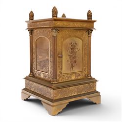 Early 20th century brass mantle clock, the face and case profusely engraved with floral scrolls, the sides inset with hunting scene panels, flanked by four Corinthian columns with acorn finials, striking the hours and halves on bell, H20.5cm W13cm