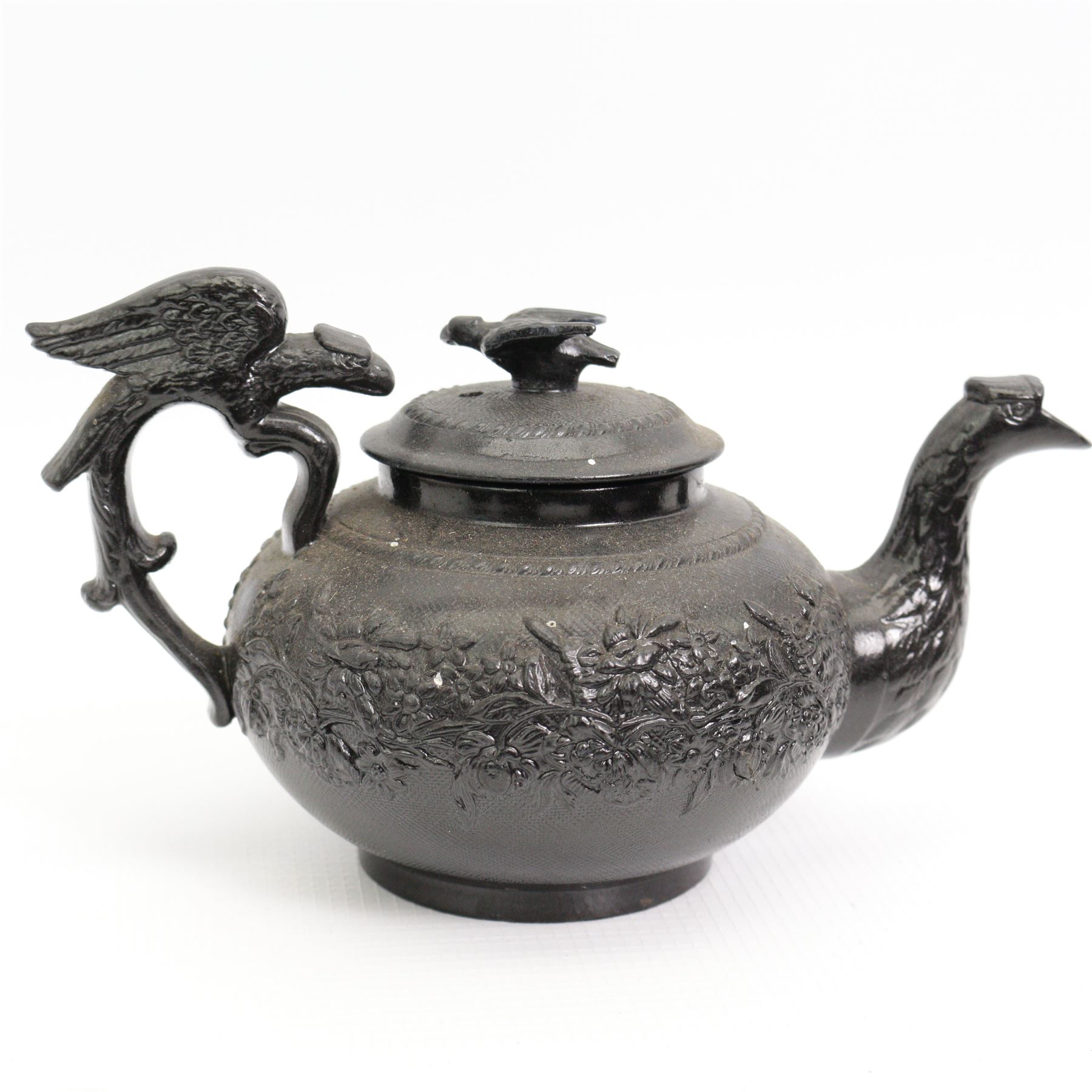 Early 19th century and later black basalt tea wares, mostly with relief or engine-turned bodies, including a Cyples bachelors teapot, other teapots, jugs etc in one box