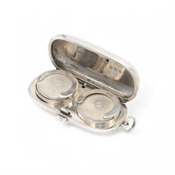 Edwardian silver sovereign holder, of plain oval form, the hinged cover opening to reveal two spring loaded recesses, hallmarked Dennison Watch Case Co, Birmingham 1910, L5.5cm