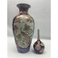 Large Imari vase of baluster form the panels depicting peacocks in a garden setting, together with a small imari vase, large vase H38cm