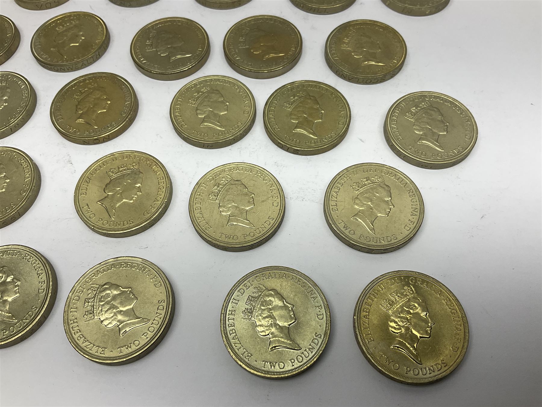 Twenty-eight Queen Elizabeth II old style two pound coins, including 1994 'Bank of England' etc